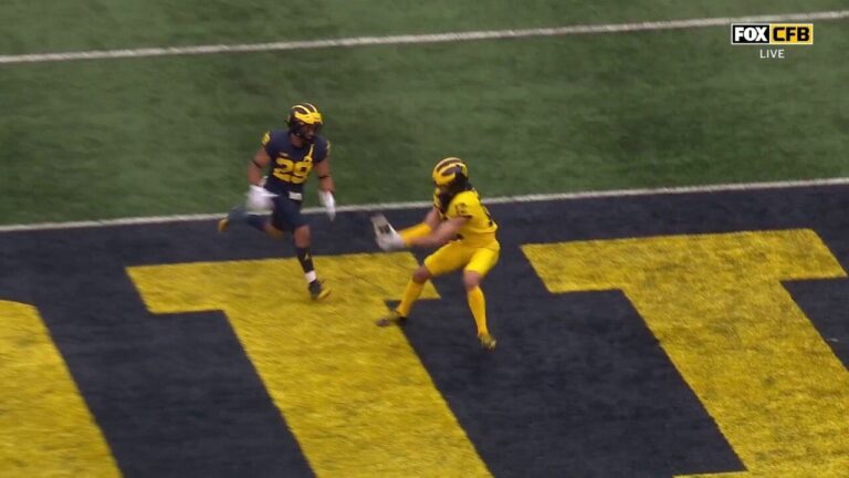 Davis Warren connects with Kendrick Bell on a 42-yard TD pass in Michigan