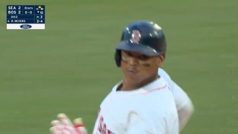 Rafael Devers and the Red Sox celebrate as they walk off the Mariners in the 10th inning