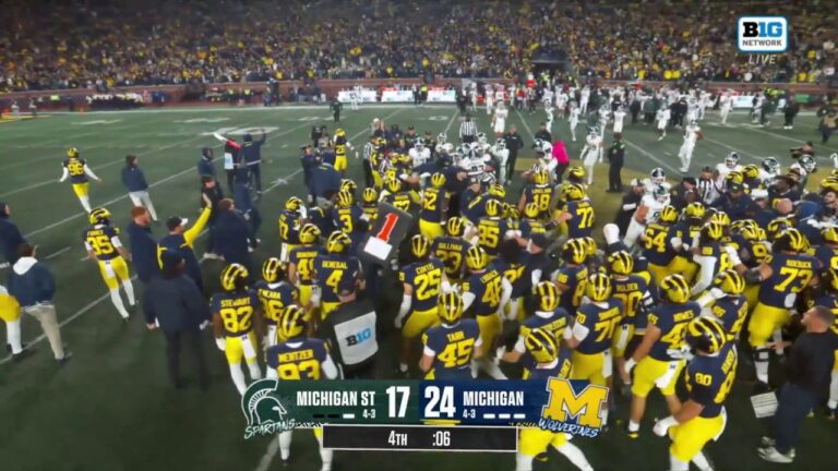 Rivals Michigan and Michigan State break out into massive brawl at the end of the Wolverines